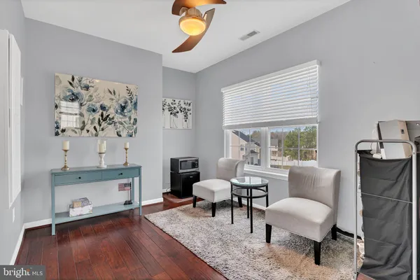 an aerial view of a house with swimming pool and patio