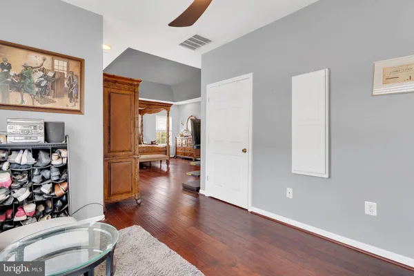 an aerial view of a house with swimming pool and outdoor seating