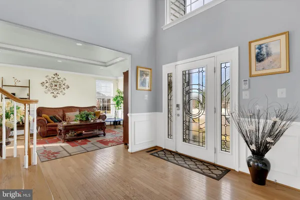 a living room with furniture window and a flat screen tv