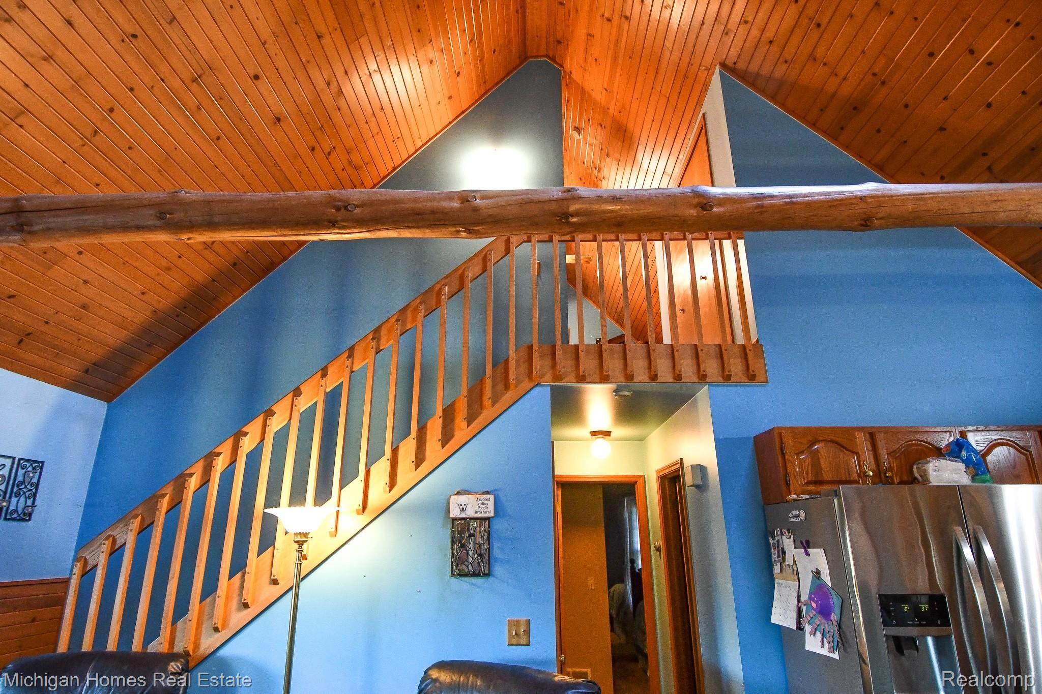 7235 Lahring Road Gaines, MI 48436 - Photo 28 of 81 LOFT AREA USED AS MASTER BEDROOM - HAS CLOSET AND STORAGE SPACES BUILT IN, ALONG WITH PRIVATE DECK