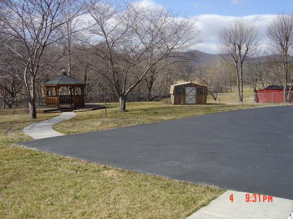 3051 Webster Road Blue Ridge, VA 24064 - Photo 22 of 39 a view of a house with a yard