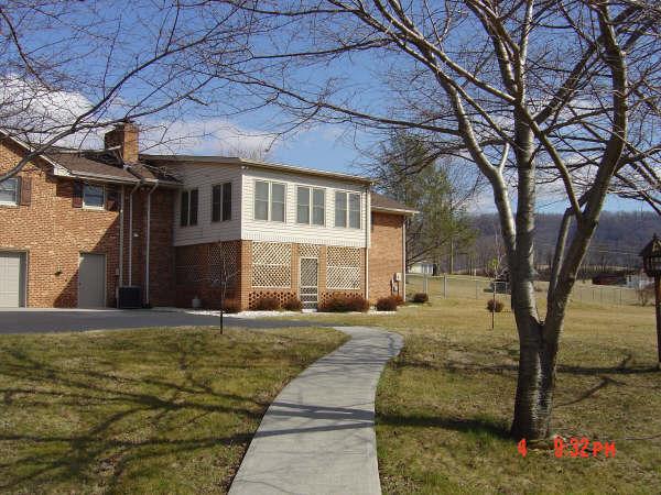 3051 Webster Road Blue Ridge, VA 24064 - Photo 36 of 39 a front view of a house with a yard