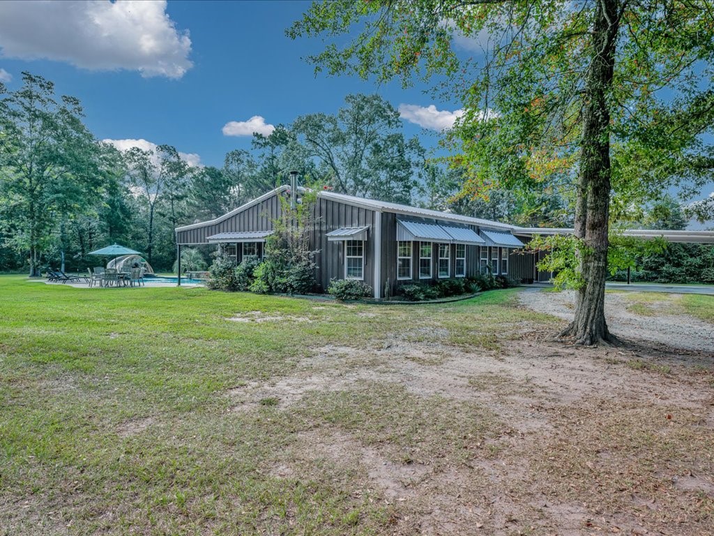 3335 Bethlehem Road Lufkin, TX 75904 - Photo 12 of 50 a view of a house with backyard and a tree