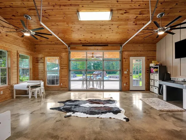 a lobby with furniture and floor to ceiling window