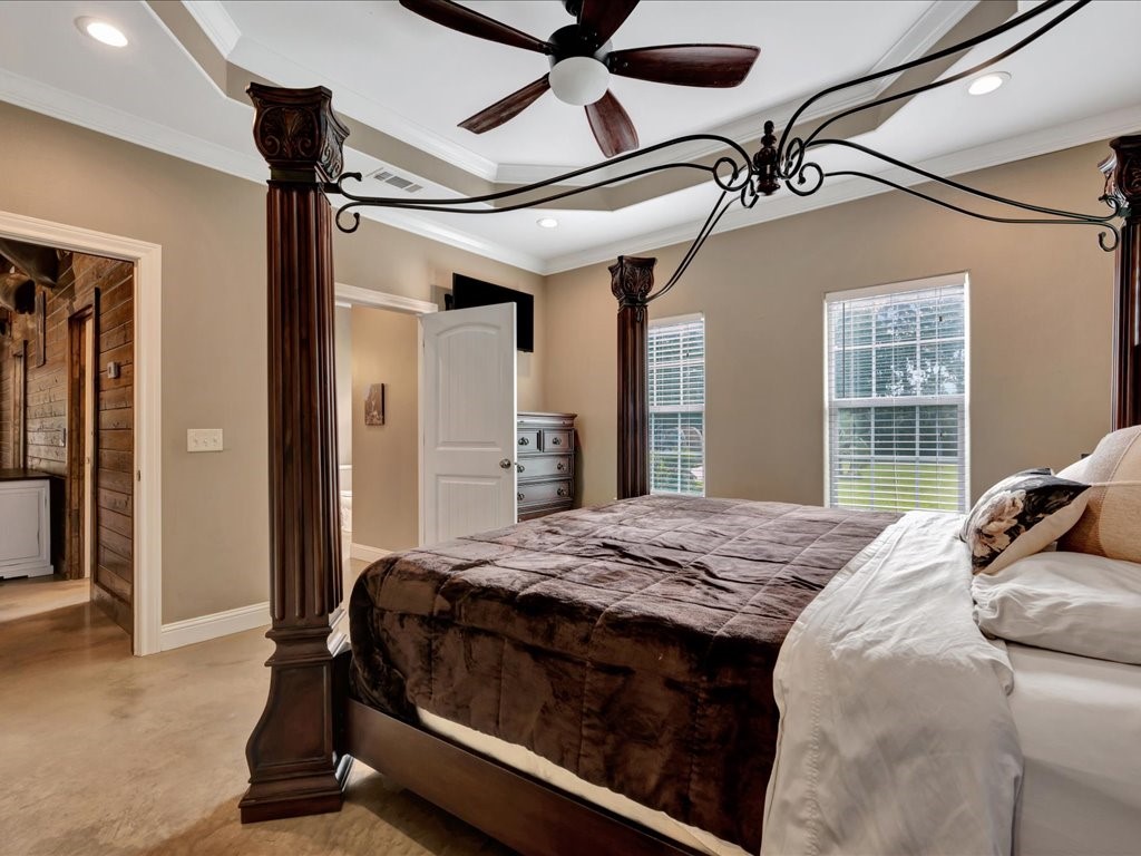 3335 Bethlehem Road Lufkin, TX 75904 - Photo 31 of 50 a bedroom with a bed and a chandelier