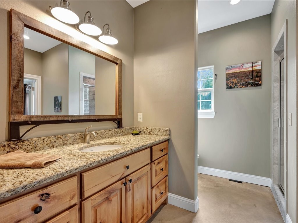 3335 Bethlehem Road Lufkin, TX 75904 - Photo 32 of 50 a bathroom with a granite countertop double vanity sink and a mirror