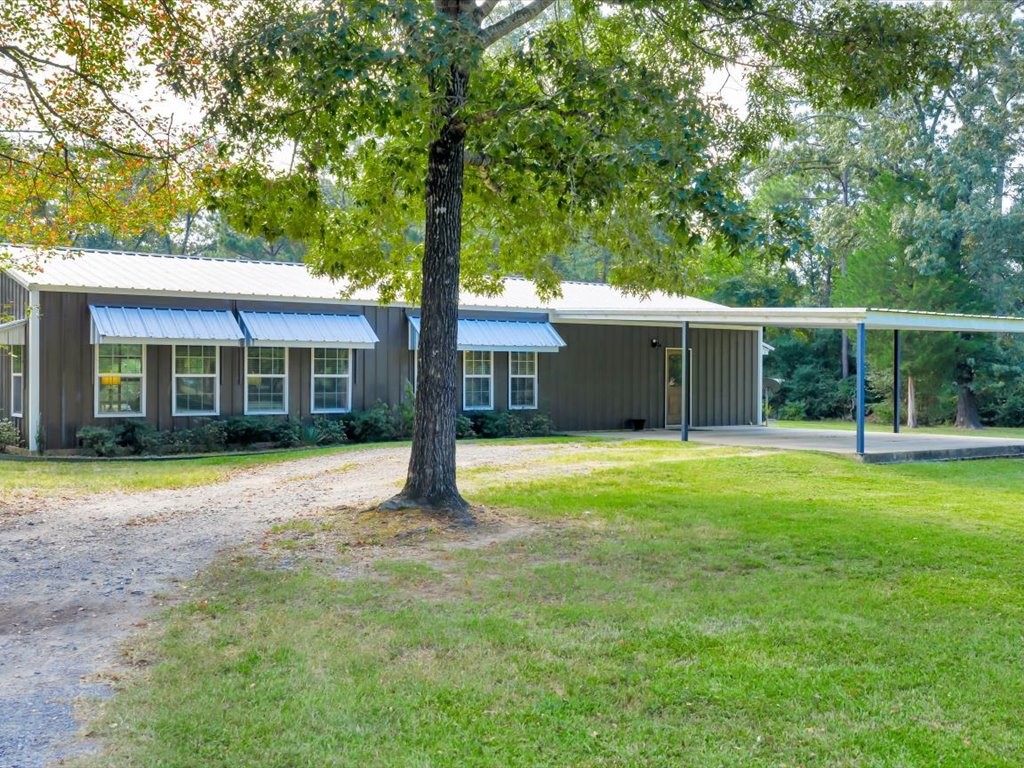 3335 Bethlehem Road Lufkin, TX 75904 - Photo 8 of 50 a view of a house with a yard and a large tree