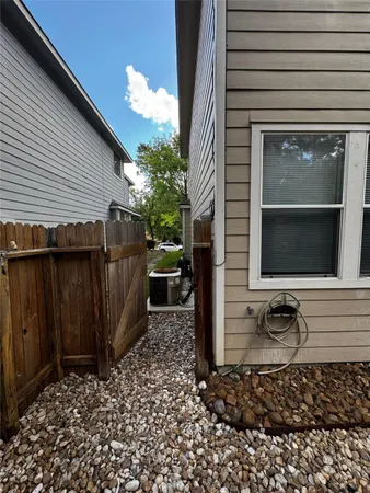 a view of a pathway of a house with a chair