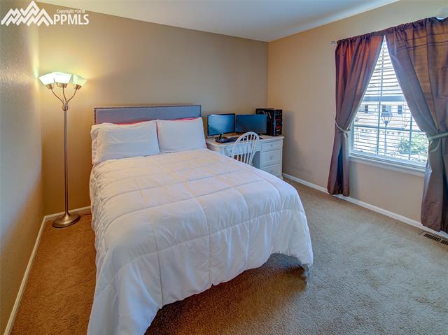 829 Spectrum Loop Colorado Springs, CO 80921 - Photo 12 of 19 Bedroom #4 with double sliding door closet to the right.