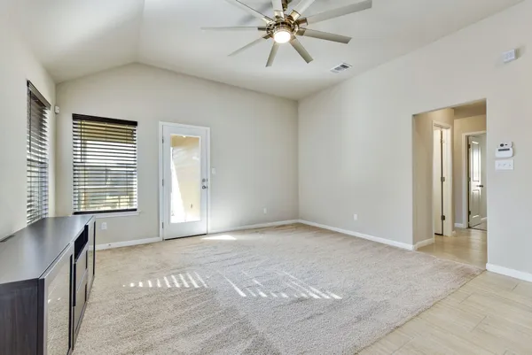 a view of an empty room with a window
