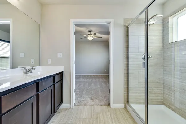 a bathroom with a sink and shower