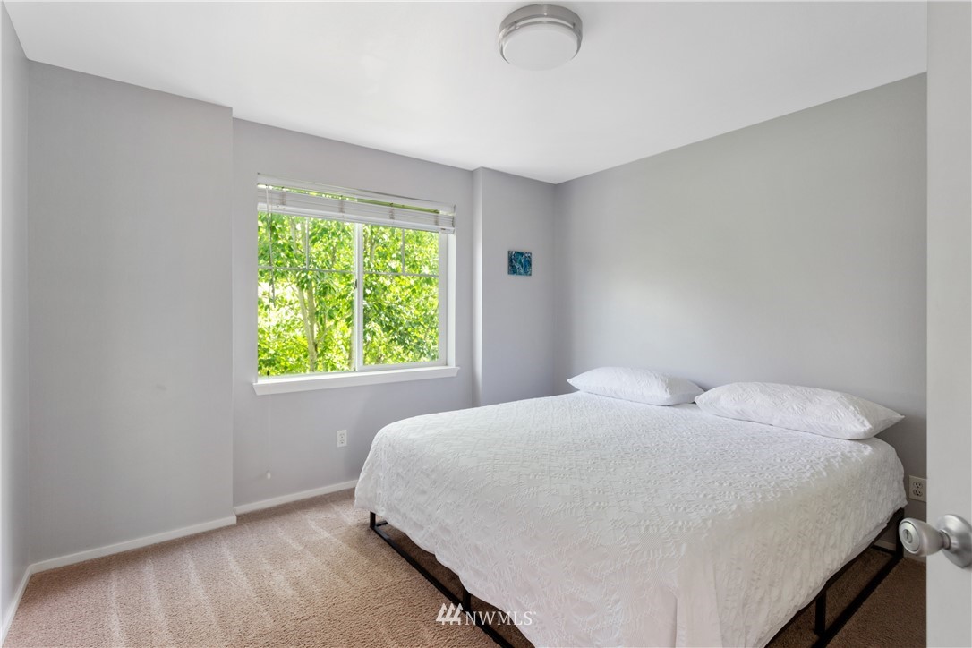 529 Chelan Place Northeast Renton, WA 98059 - Photo 13 of 20 a bedroom with a bed and a window
