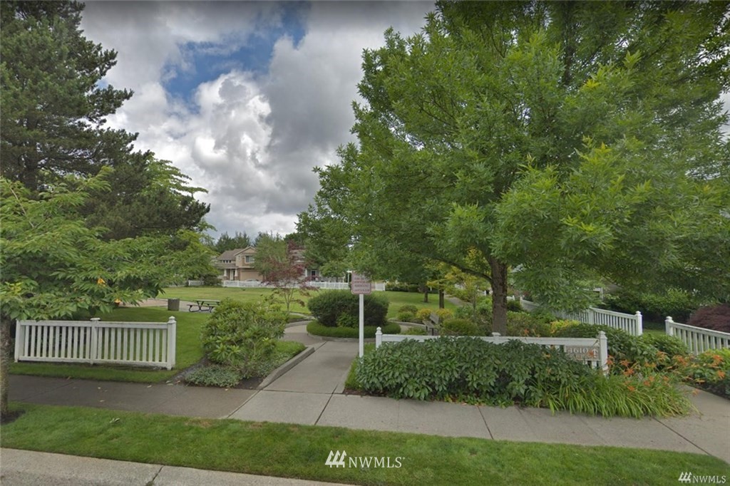 529 Chelan Place Northeast Renton, WA 98059 - Photo 19 of 20 a view of a green yard in front of a house