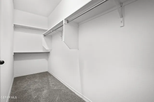 a view of an empty walk in closet