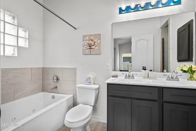 a bathroom with a toilet a sink and bathtub