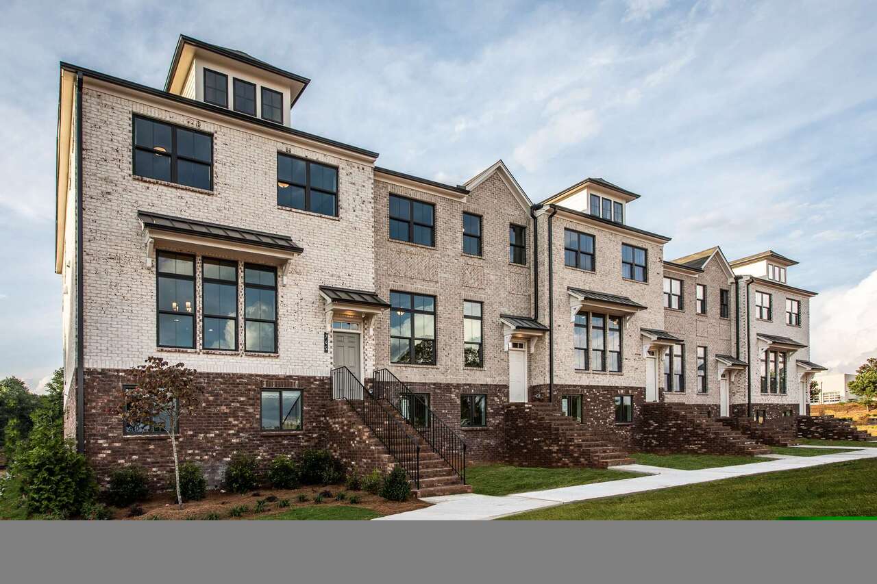 840 Fairview Circle, Unit 4 Roswell, GA 30076 - Photo 1 of 1 a front view of a house with garden