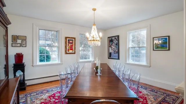 a view of a dining room with furniture window and wooden floor
