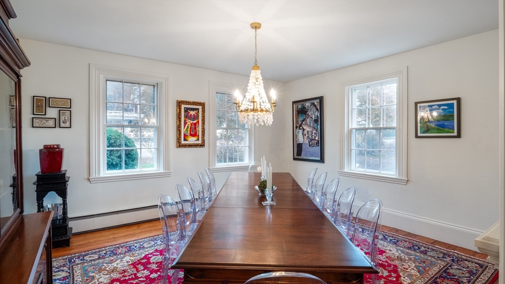 239 High Road Newbury, MA 01951 - Photo 13 of 42 a view of a dining room with furniture window and wooden floor
