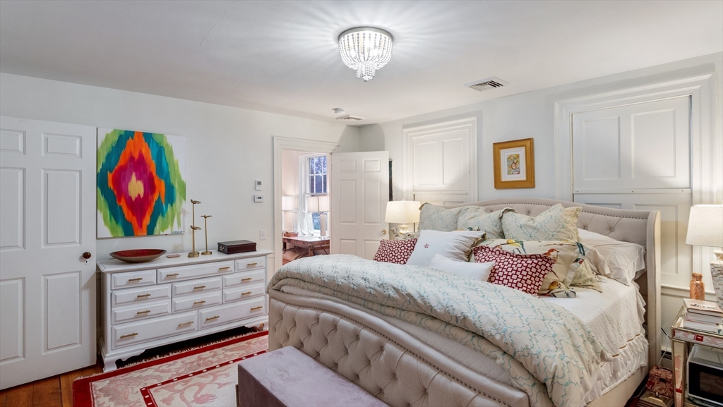 239 High Road Newbury, MA 01951 - Photo 23 of 42 a bedroom with a bed and furniture