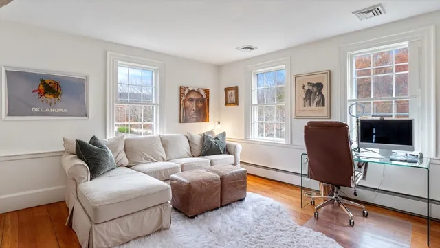 a living room with furniture and a window