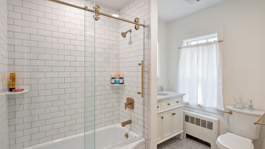239 High Road Newbury, MA 01951 - Photo 29 of 42 a bathroom with a bathtub a toilet and a shower