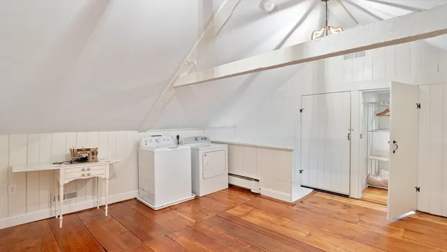 a view of a kitchen with wooden floor