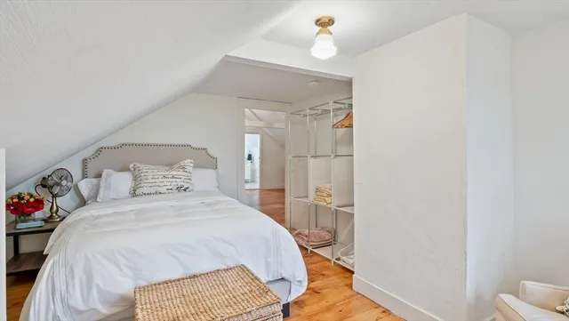 a bedroom with a bed and a table