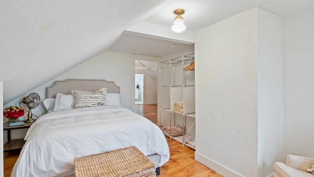 239 High Road Newbury, MA 01951 - Photo 31 of 42 a bedroom with a bed and a table