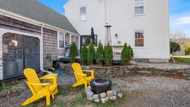 a view of a chair with fire pit in patio