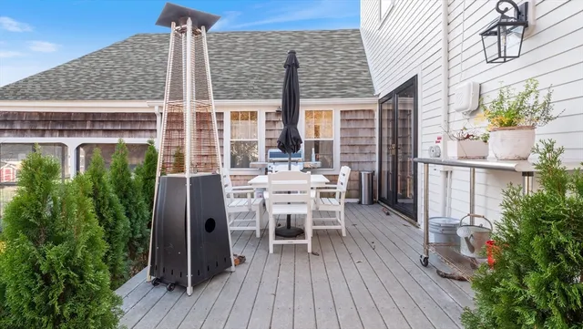 a view of a patio with table and chairs and potted plants