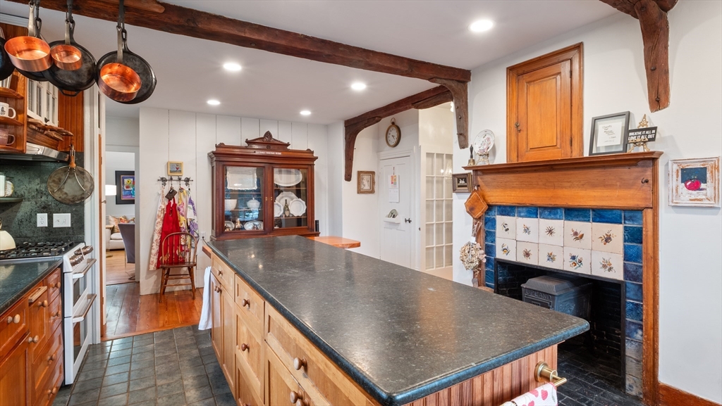 239 High Road Newbury, MA 01951 - Photo 8 of 42 an open kitchen with a sink a microwave and a stove