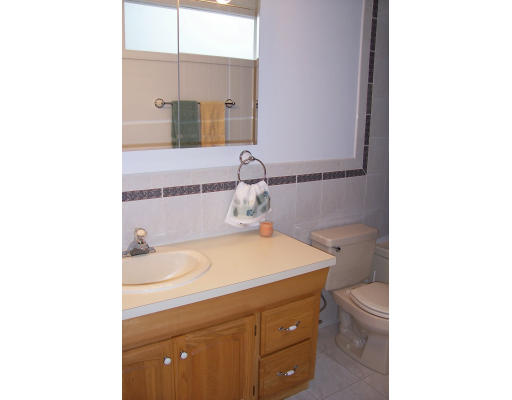 114 Mountain Gate Road, Unit 114 Ashland, MA 01721 - Photo 11 of 11 a bathroom with a sink and a mirror
