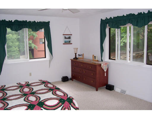 114 Mountain Gate Road, Unit 114 Ashland, MA 01721 - Photo 8 of 11 a bedroom with a bed and a dresser