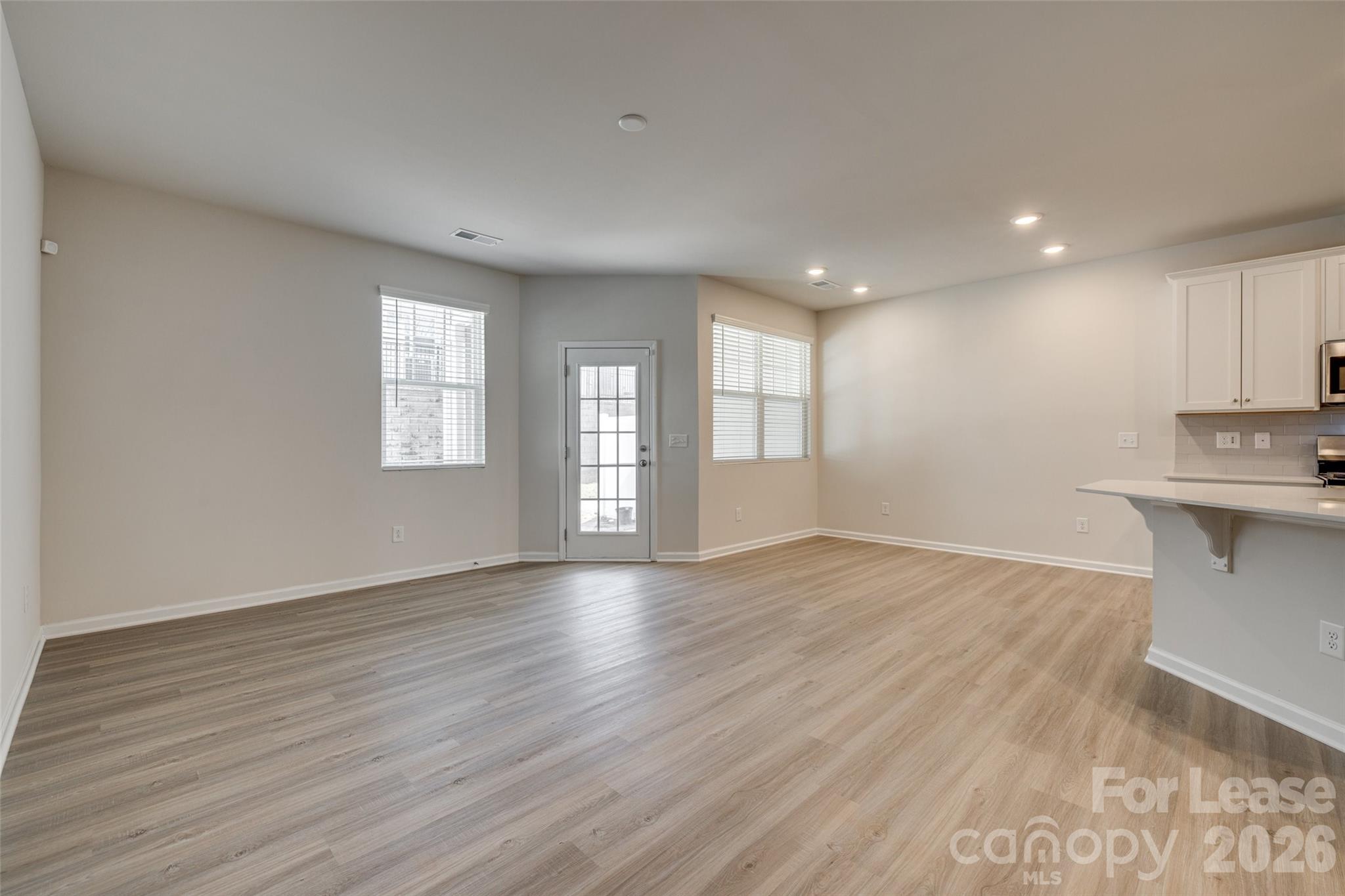 807 Gable Oak Lane Fort Mill, SC 29708 - Photo 14 of 39 a view of empty room with wooden floor and fan
