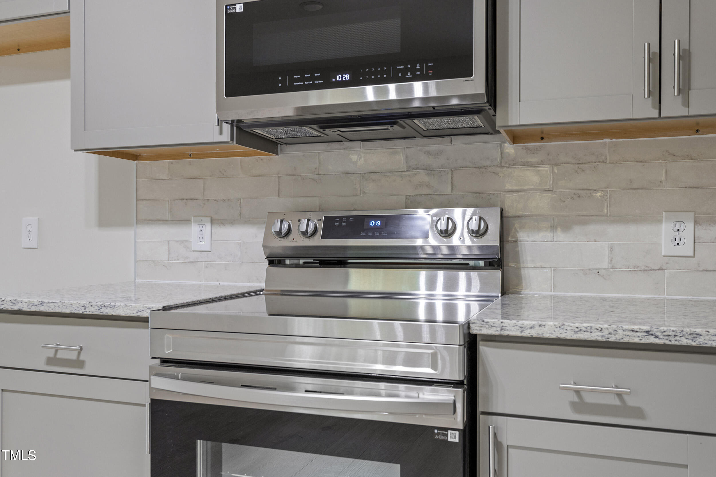 2702 Red Valley Drive Rougemont, NC 27572 - Photo 11 of 25 a kitchen with granite countertop cabinets stove and microwave