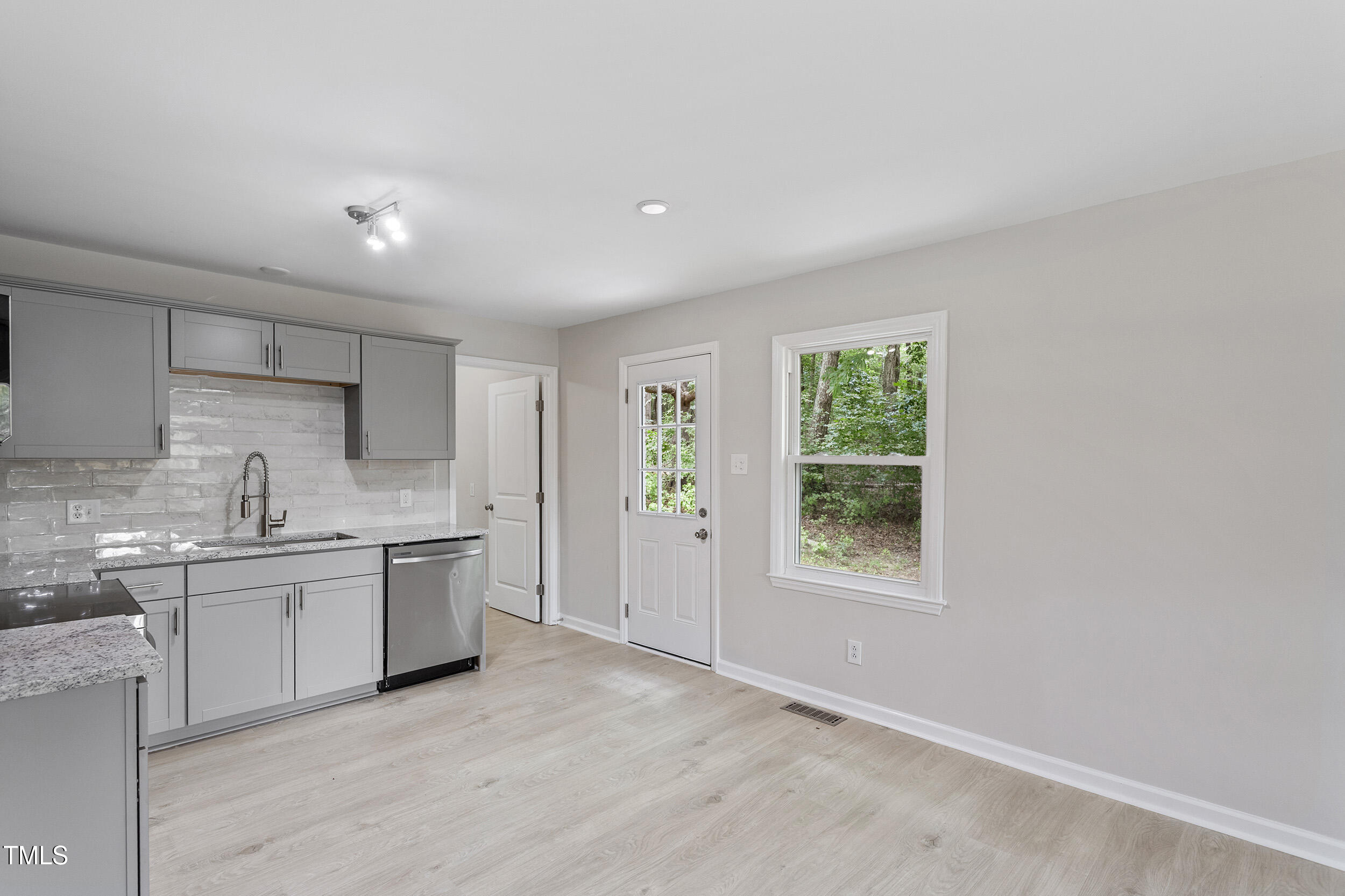 2702 Red Valley Drive Rougemont, NC 27572 - Photo 12 of 25 a kitchen with white cabinets appliances and window