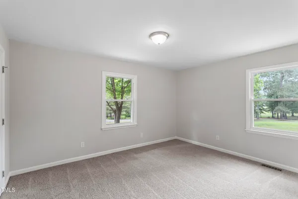 an empty room with windows