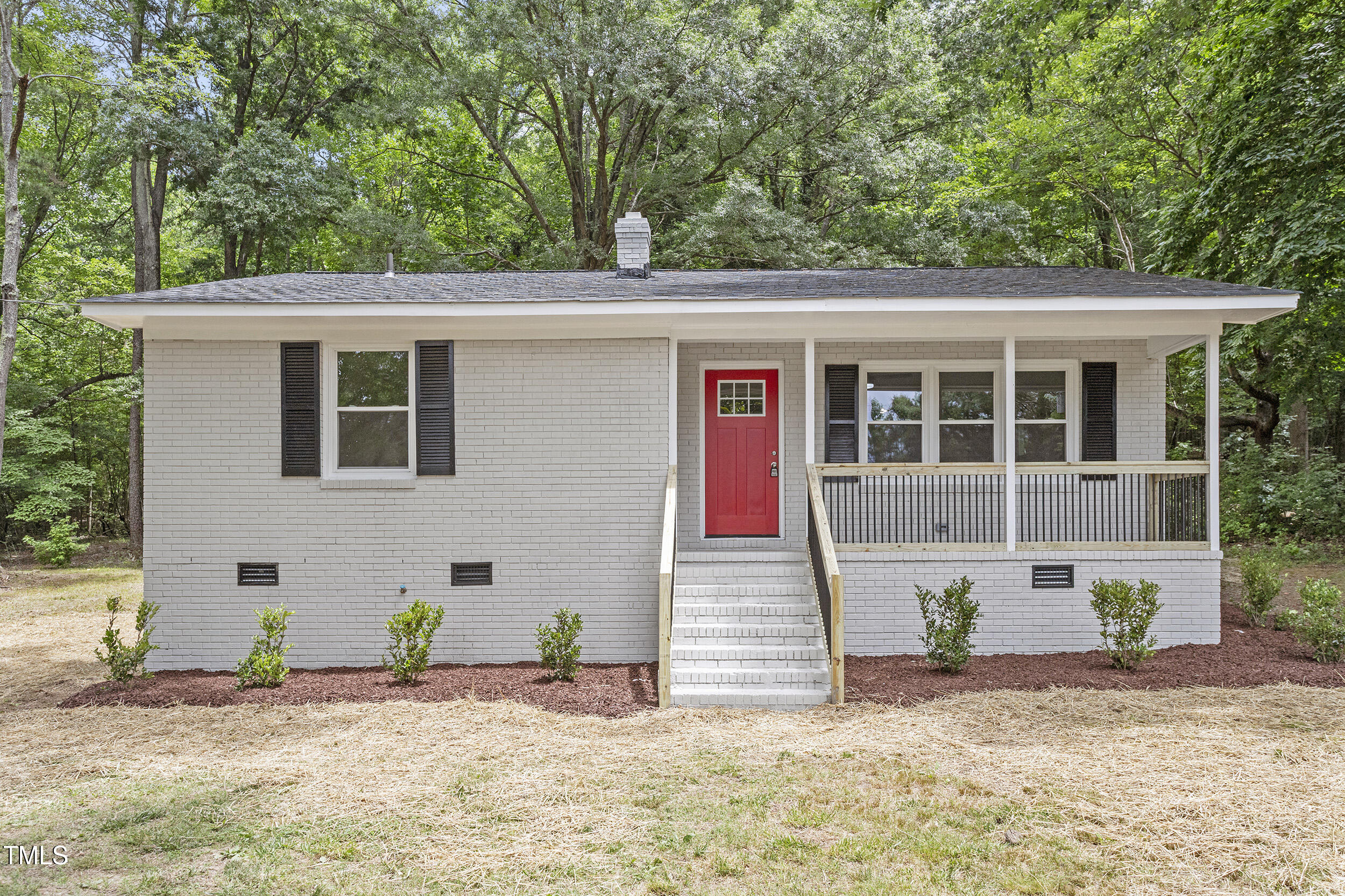 2702 Red Valley Drive Rougemont, NC 27572 - Photo 2 of 25 a front view of a house with garden