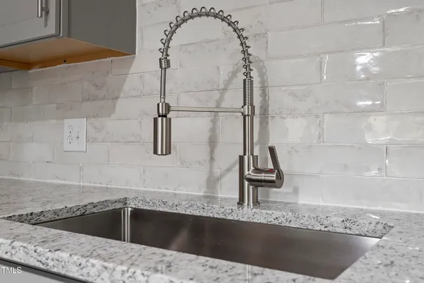 a kitchen with a sink and faucet