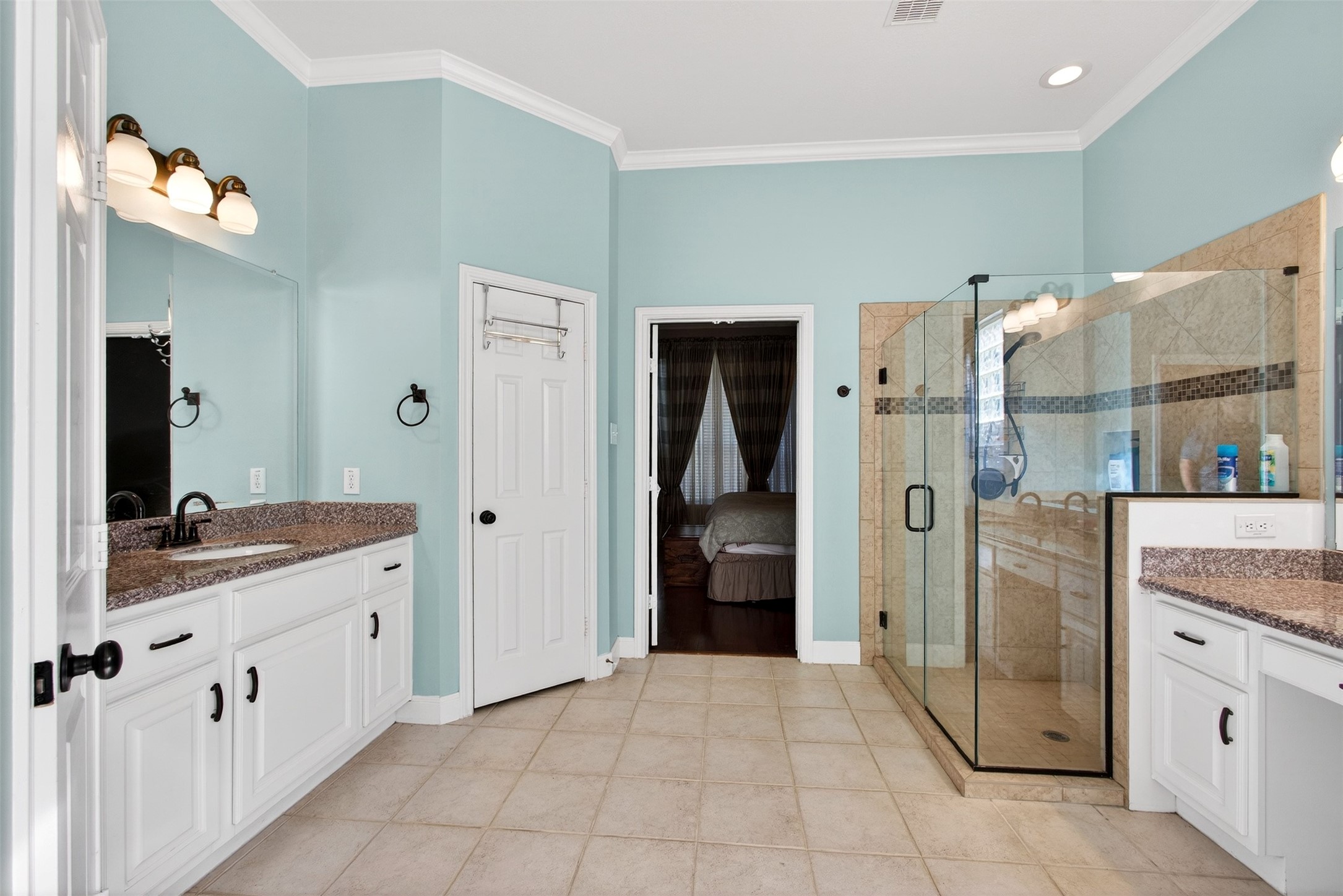 15614 Stable Brook Circle Cypress, TX 77429 - Photo 17 of 48 Primary bathroom with a jetted tub, oversized shower, and dual vanities.