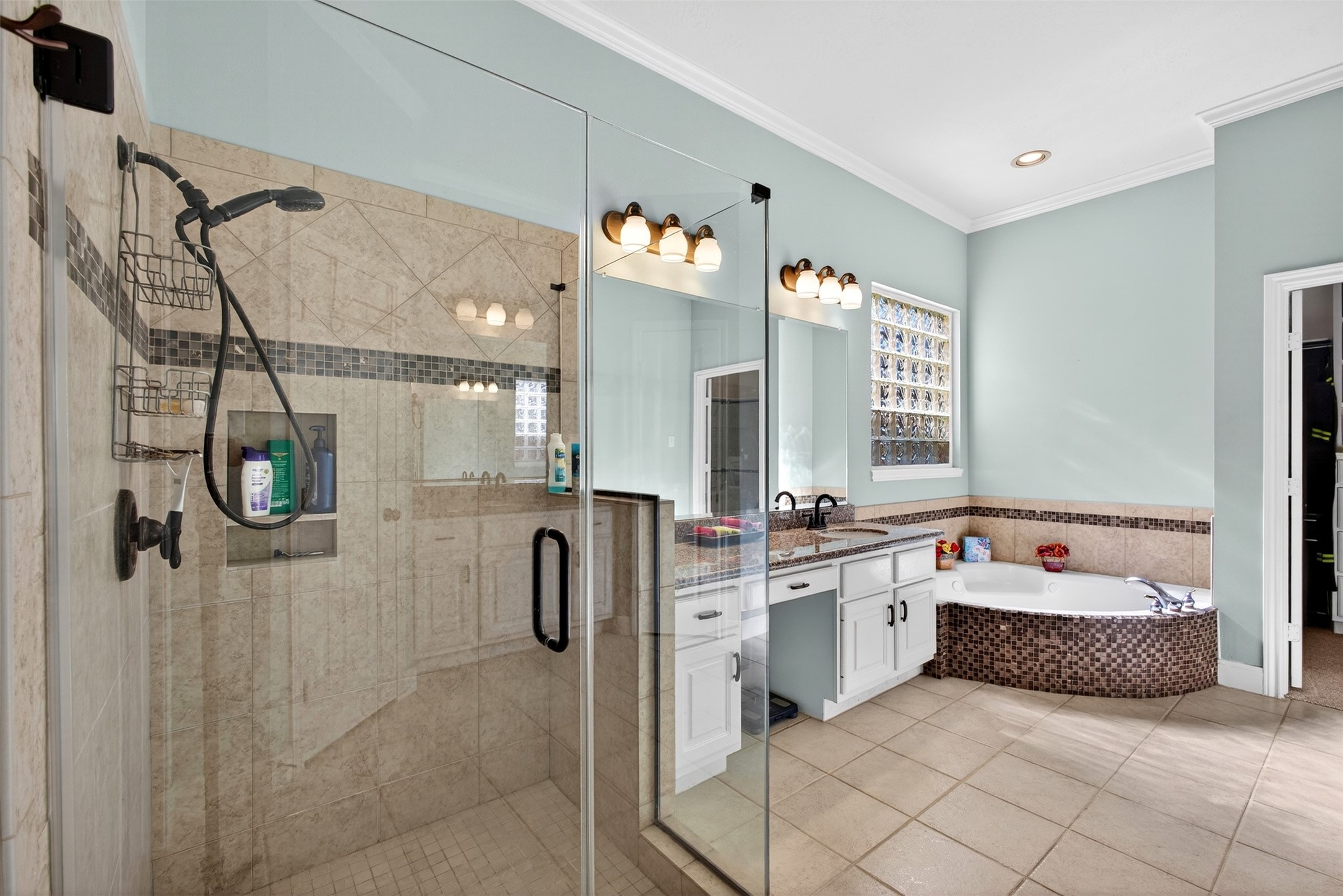 15614 Stable Brook Circle Cypress, TX 77429 - Photo 18 of 48 Primary bathroom with a jetted tub, oversized shower, and dual vanities.