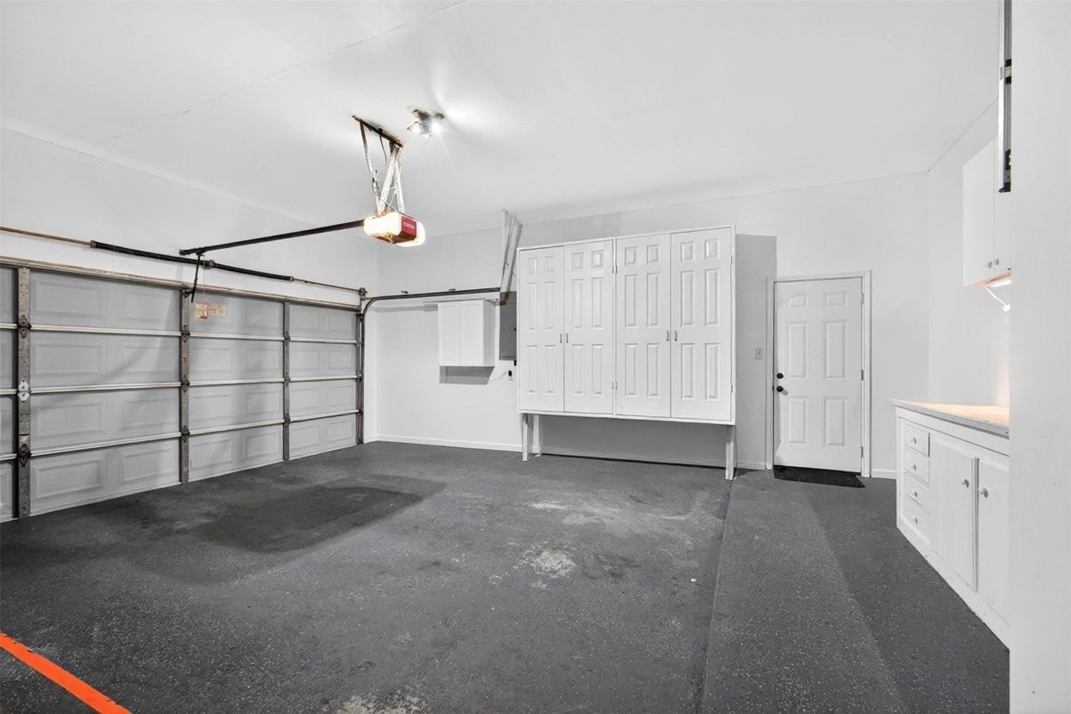 15614 Stable Brook Circle Cypress, TX 77429 - Photo 43 of 48 Garage with space for 2 cars, and plenty of storage, with a work bench (not pictured here).