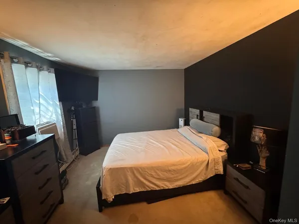 a living room with furniture window and flat screen tv
