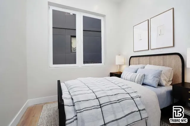 a bedroom with a bed and cabinets