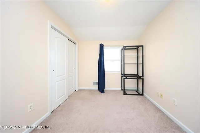 a view of a room with large windows