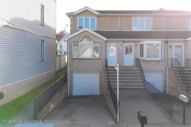 a front view of a house with a garage