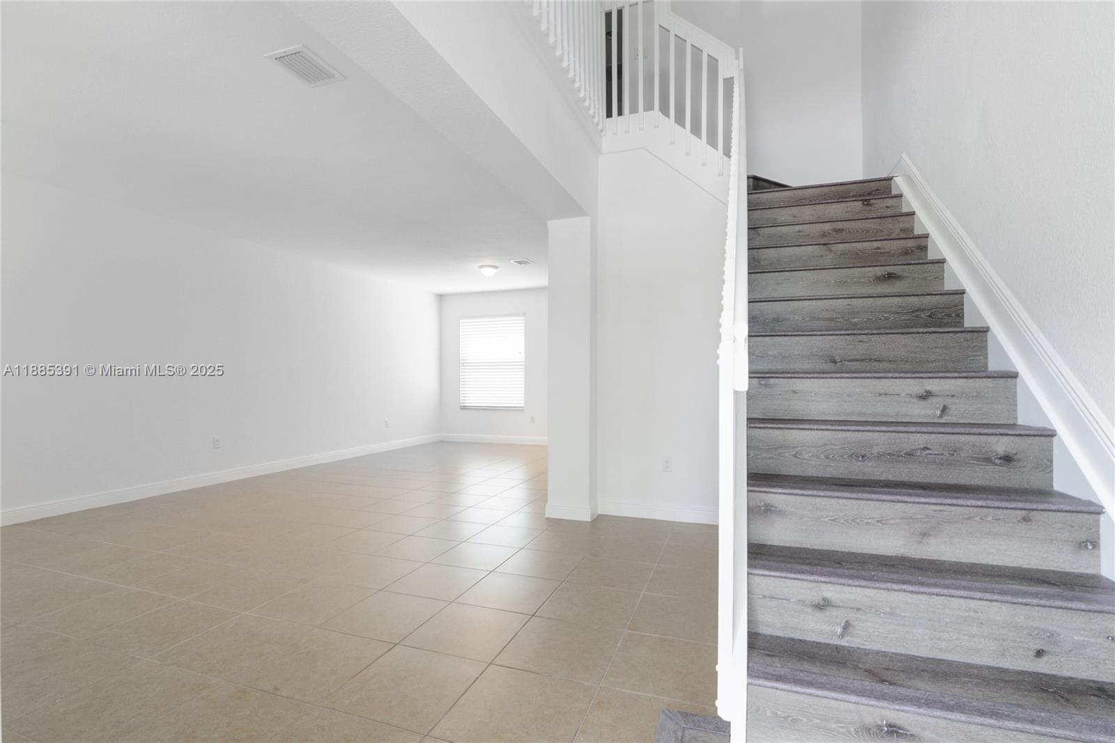 1108 Southwest 146th Terrace Pembroke Pines, FL 33027 - Photo 3 of 14 a view of an entryway with staircase