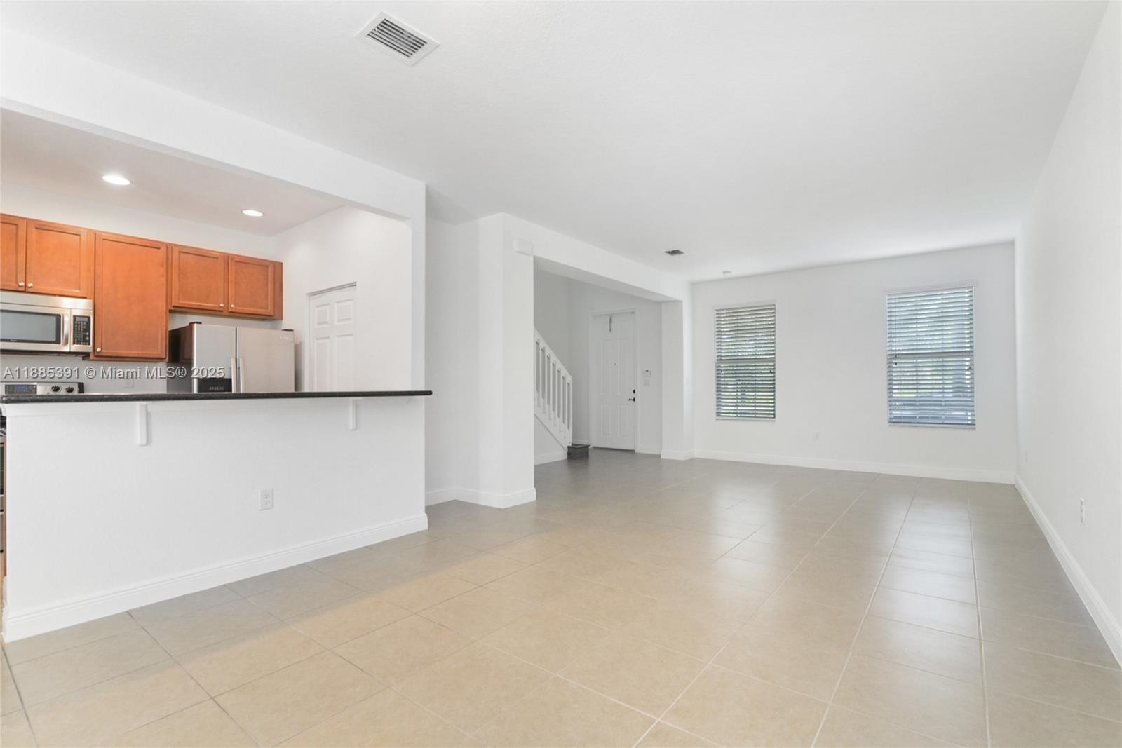 1108 Southwest 146th Terrace Pembroke Pines, FL 33027 - Photo 5 of 14 a view of a kitchen with a sink and cabinets