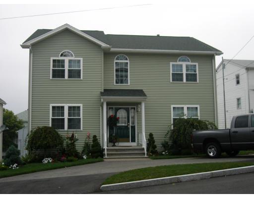 206 Manchester Street Fall River, MA 02721 - Photo 1 of 12 a front view of a house with a yard