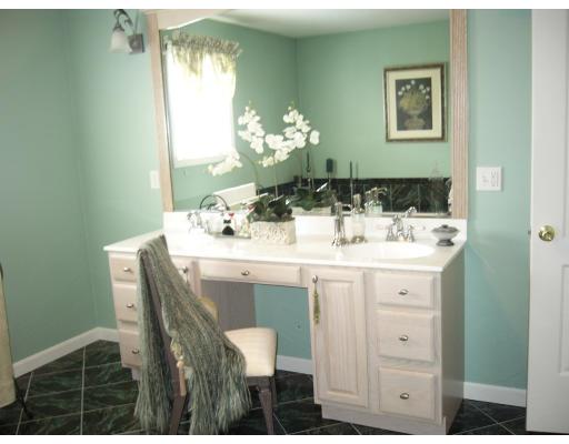 206 Manchester Street Fall River, MA 02721 - Photo 3 of 12 a room with a sink and a mirror